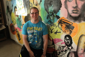 Cal U Student Alex Lafferty (center) graphics major, works to finish the Hip-Hop mural April 2012.